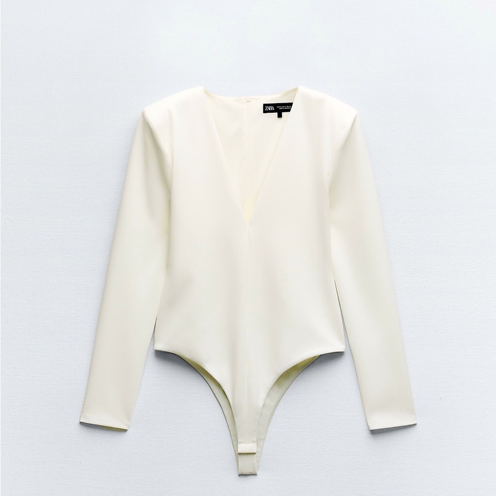 Stretch should pad bodysuit in size S in color white